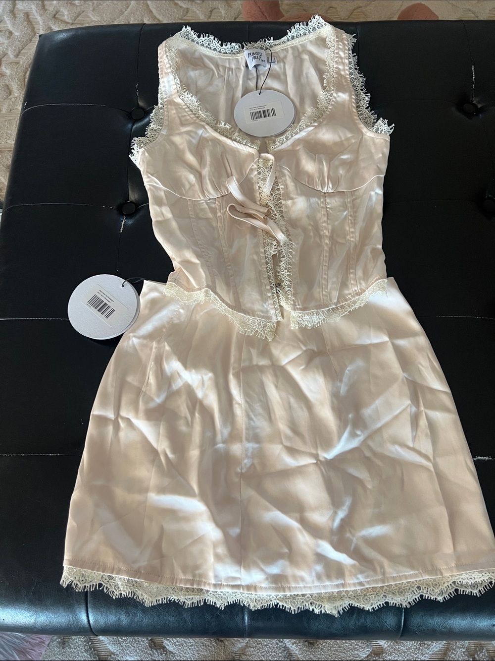 Princess Polly Cream Lace-Trim Satin women’s top and skirt set.